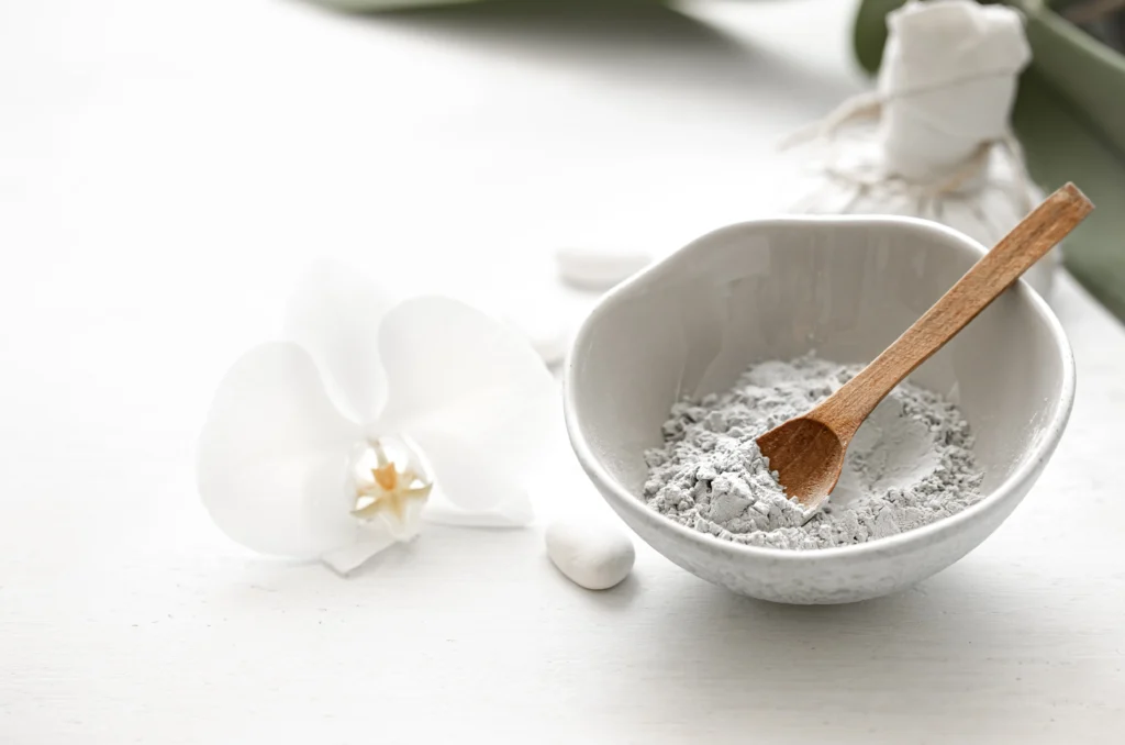 Food-grade Diatomaceous Earth powder applied to houseplant soil to kill fungus gnat larvae.