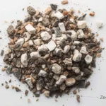 Premium aroid soil mix components showing pumice, orchid bark, tree fern fiber, coco coir, and zeolite arranged separately before mixing, demonstrating chunk houseplant soil texture